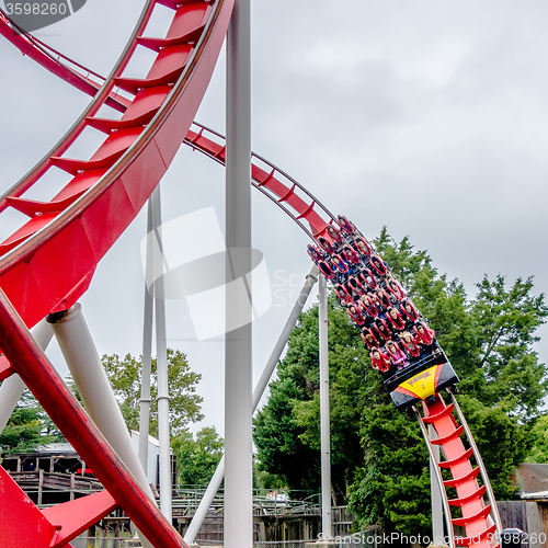 Image of crazy rollercoaster rides at amusement park