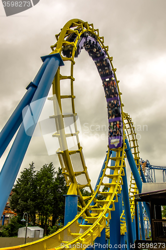 Image of crazy rollercoaster rides at amusement park