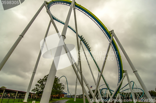 Image of crazy rollercoaster rides at amusement park