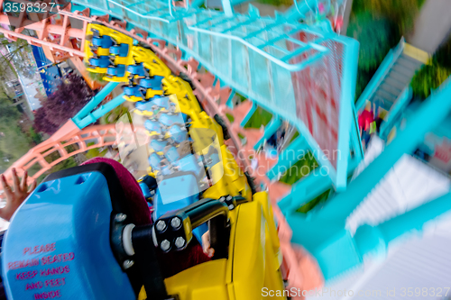 Image of crazy rollercoaster rides at amusement park