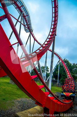 Image of crazy rollercoaster rides at amusement park