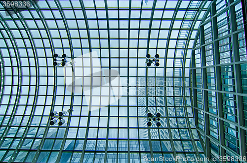 Image of glass roof structure space fram of modern building hall