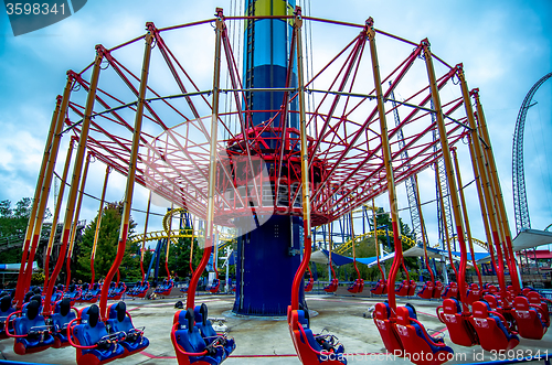 Image of crazy rollercoaster rides at amusement park