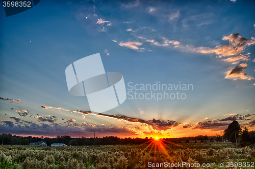 Image of sun setting over country farm land in york south carolina