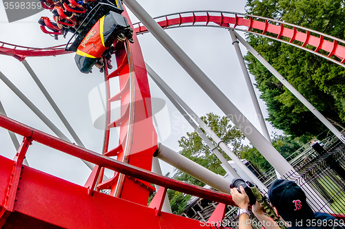 Image of crazy rollercoaster rides at amusement park