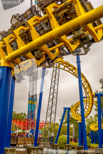 Image of crazy rollercoaster rides at amusement park