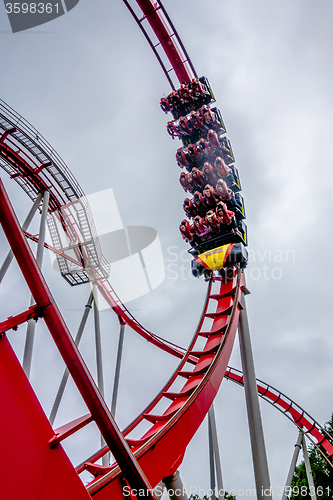 Image of crazy rollercoaster rides at amusement park