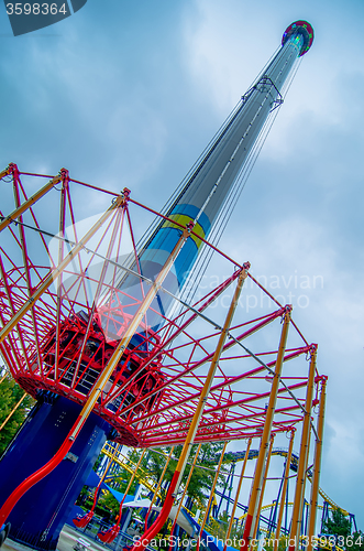 Image of crazy rollercoaster rides at amusement park