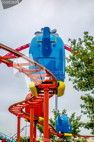 Image of kiddie helicopter amusement ride at the park