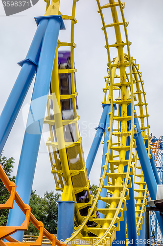 Image of crazy rollercoaster rides at amusement park