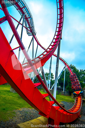 Image of crazy rollercoaster rides at amusement park