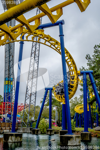 Image of crazy rollercoaster rides at amusement park