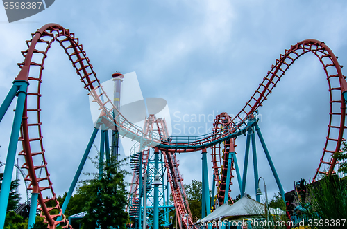 Image of crazy rollercoaster rides at amusement park