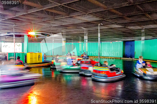 Image of bumper cars amusement ride at the park under roof
