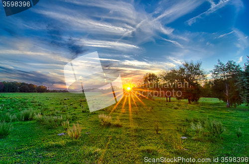 Image of sun setting over country farm land in york south carolina