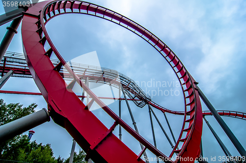 Image of crazy rollercoaster rides at amusement park