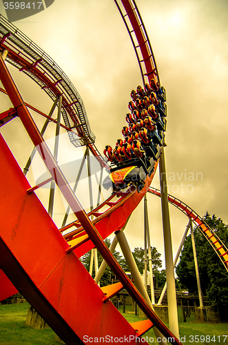 Image of crazy rollercoaster rides at amusement park