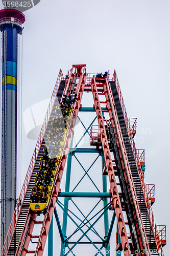Image of crazy rollercoaster rides at amusement park