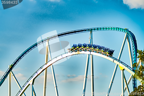 Image of crazy rollercoaster rides at amusement park