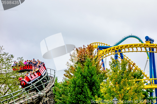 Image of crazy rollercoaster rides at amusement park