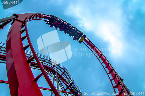 Image of crazy rollercoaster rides at amusement park