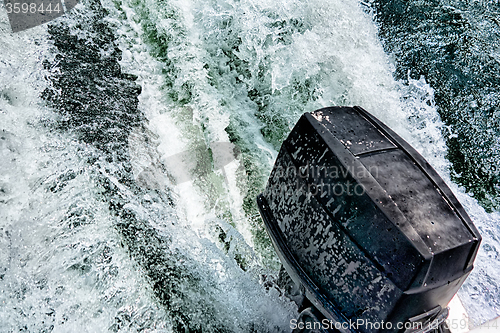 Image of boat motor pushing water in lake