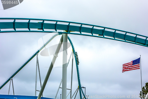 Image of crazy rollercoaster rides at amusement park