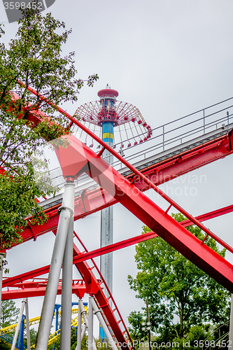 Image of crazy rollercoaster rides at amusement park