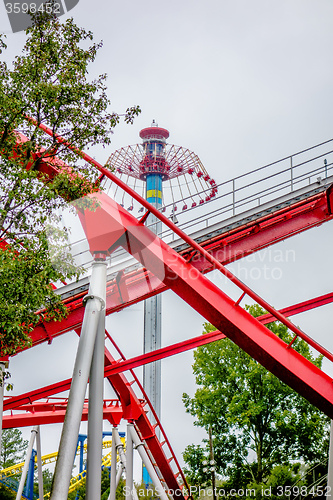 Image of crazy rollercoaster rides at amusement park