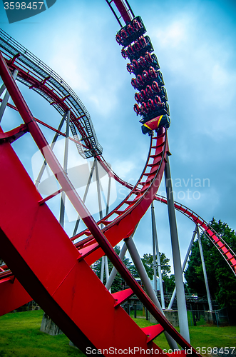 Image of crazy rollercoaster rides at amusement park