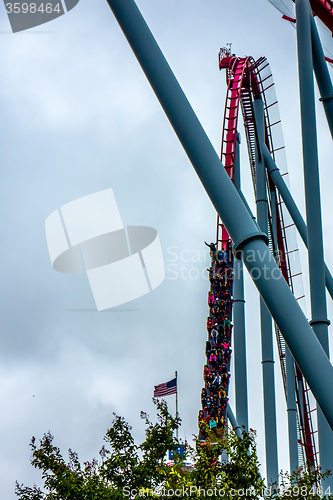 Image of crazy rollercoaster rides at amusement park