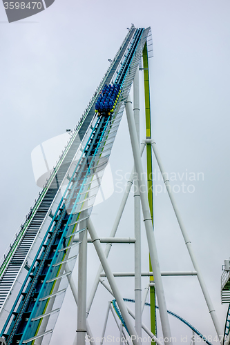 Image of crazy rollercoaster rides at amusement park