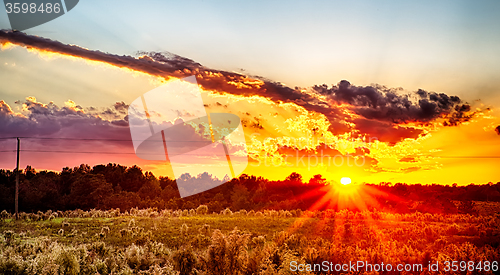 Image of sun setting over country farm land in york south carolina