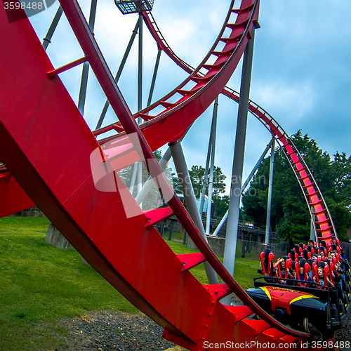 Image of crazy rollercoaster rides at amusement park