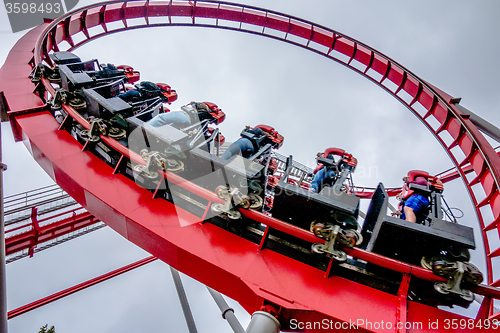 Image of crazy rollercoaster rides at amusement park