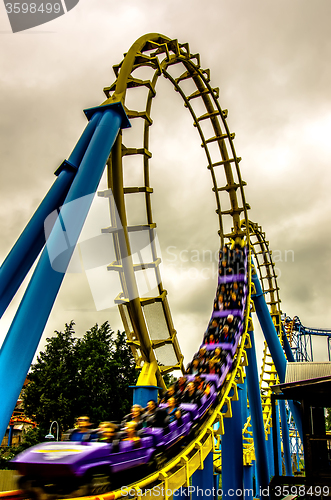 Image of crazy rollercoaster rides at amusement park