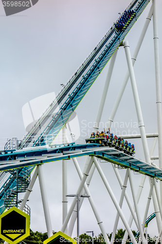 Image of crazy rollercoaster rides at amusement park