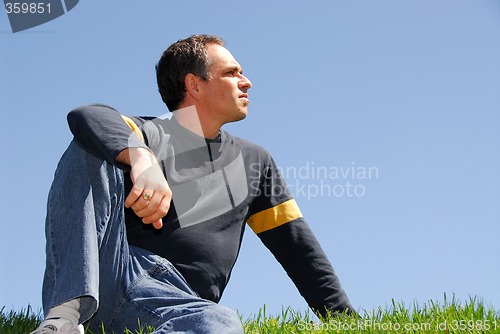 Image of Man looking at sky