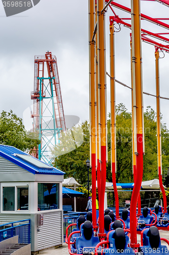 Image of crazy rollercoaster rides at amusement park