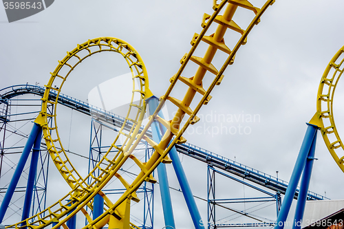 Image of crazy rollercoaster rides at amusement park