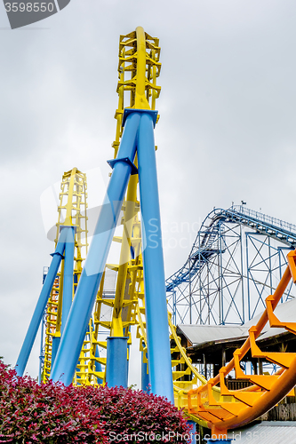 Image of crazy rollercoaster rides at amusement park