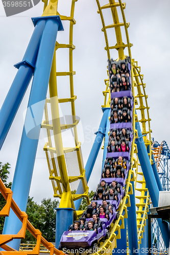 Image of crazy rollercoaster rides at amusement park