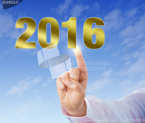 Image of Index Finger Touching A Golden New Year 2016