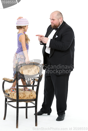 Image of Little Girl and Servant in Tuxedo Have Fun