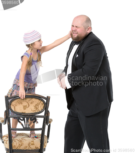 Image of Little Girl and Servant in Tuxedo Have Fun