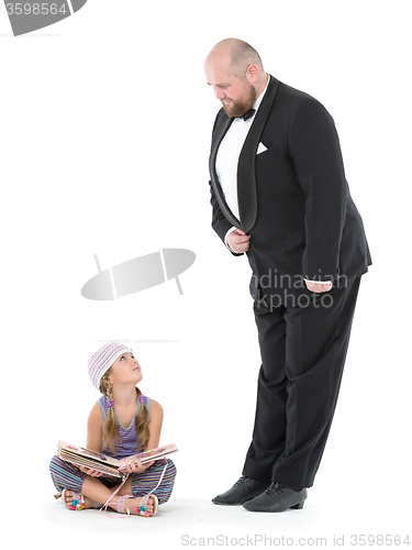 Image of Little Girl and Servant in Tuxedo Looking at Each Other