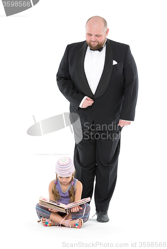 Image of Little Girl and Servant in Tuxedo