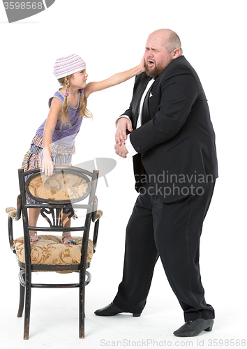 Image of Little Girl and Servant in Tuxedo Have Fun