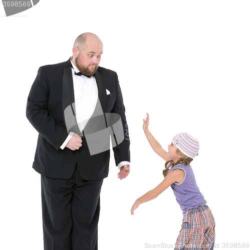 Image of Little Girl and Servant in Tuxedo Have Fun