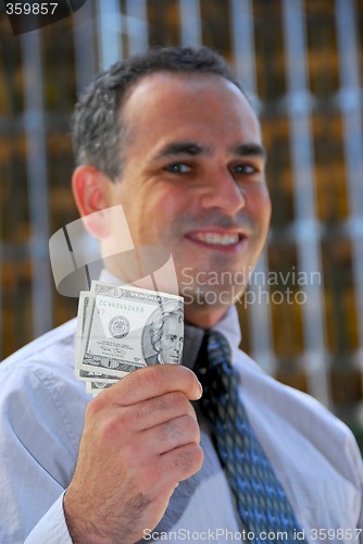 Image of Businessman hold money